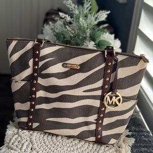 MK Michael Kors animal print zebra  brown & beige canvas shoulder tote bag.